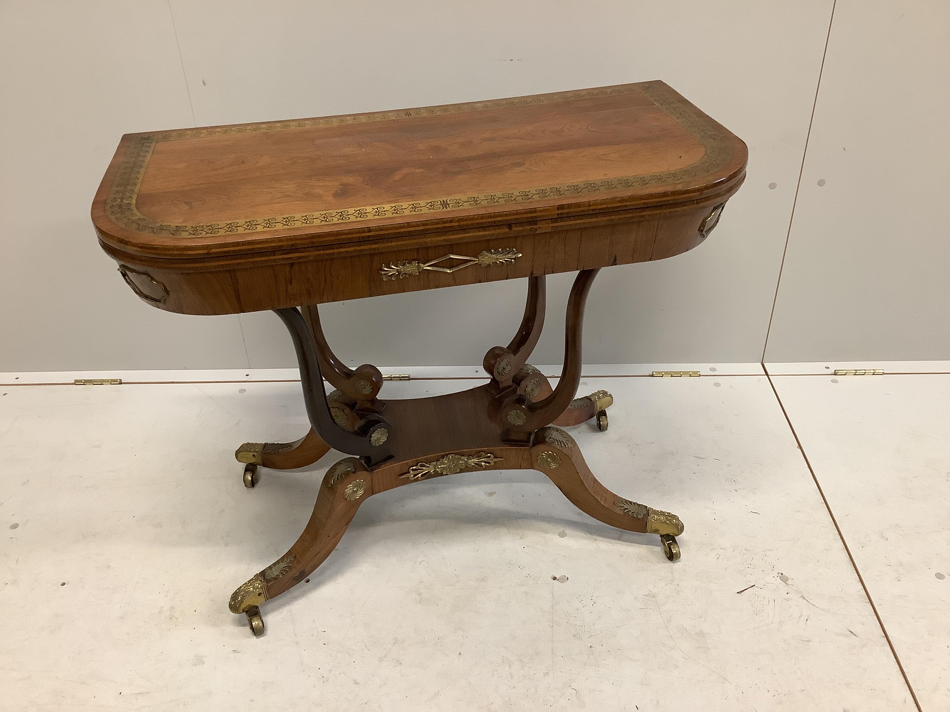 A Regency cut brass inlaid and gilt metal mounted rosewood card table, width 91cm, depth 46cm, height 71cm